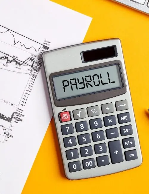 Calculator showing payroll with financial chart